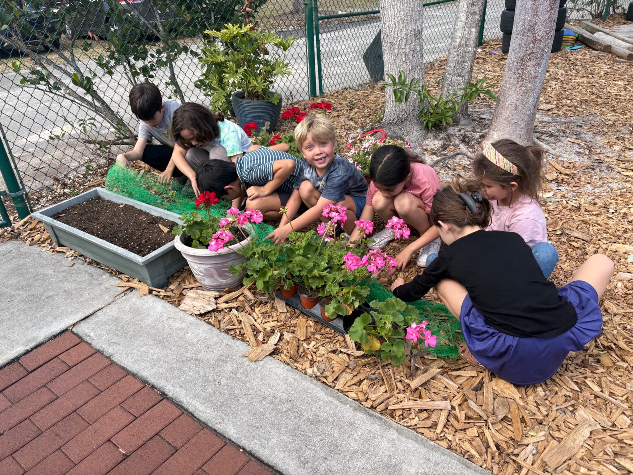 GROW students tending the pollinator garden