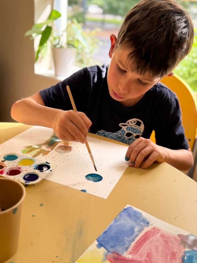 GROW student doing watercolor painting — mixed media art