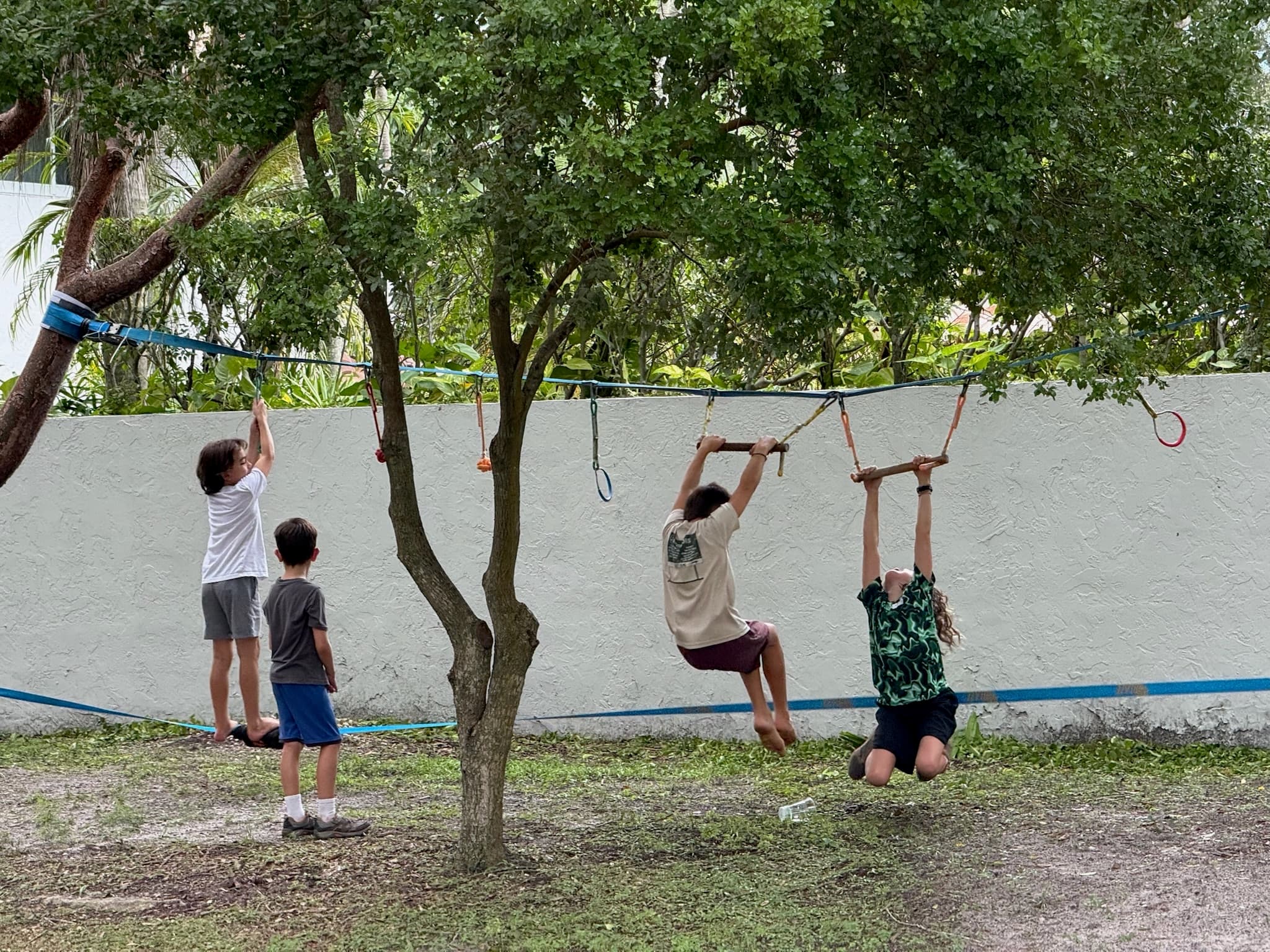 GROW students on the outdoor climbing structure — free play and movement