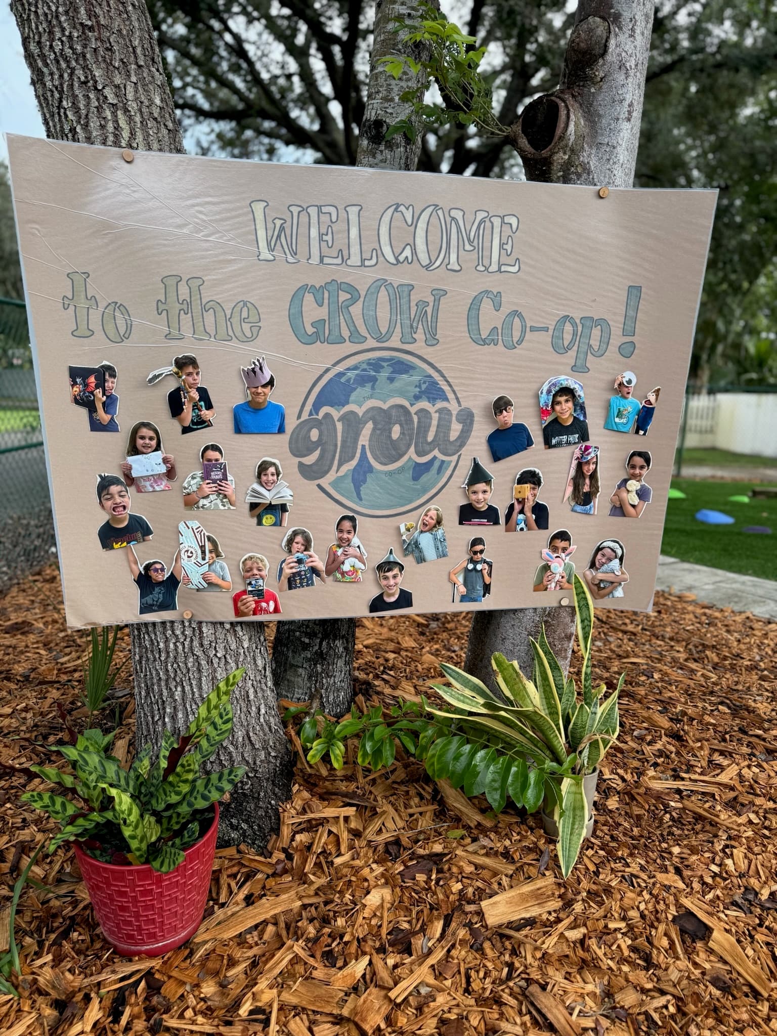 Welcome to the Grow Co-op handmade sign with student photos